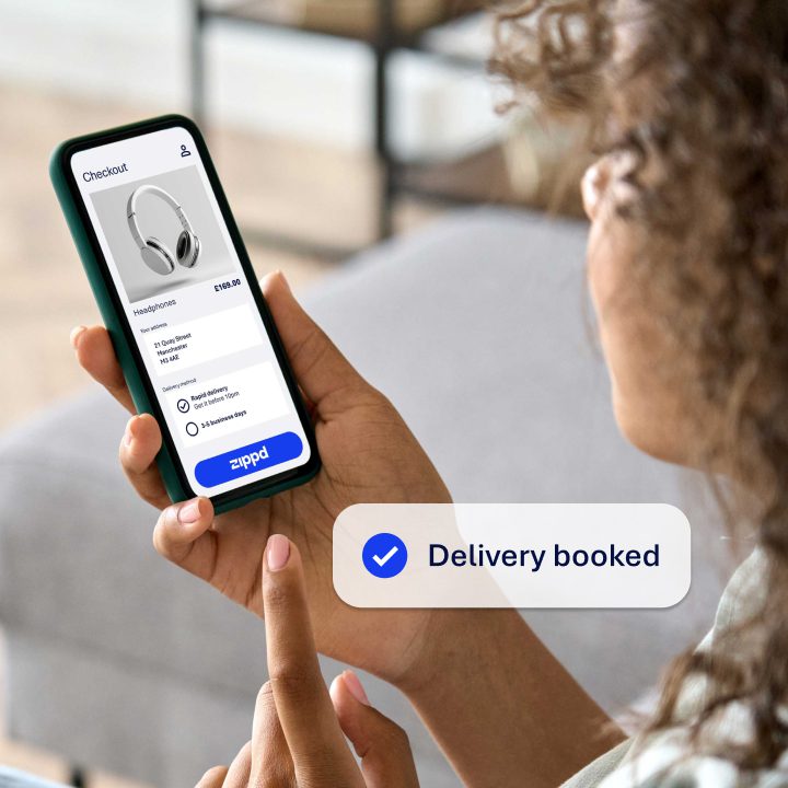 an image showing a women ordering some headphones via an ecommerce site on her mobile, and selecting Zippd same day delivery. Overlayed on the image is a notification showing 'Delivery Booked'